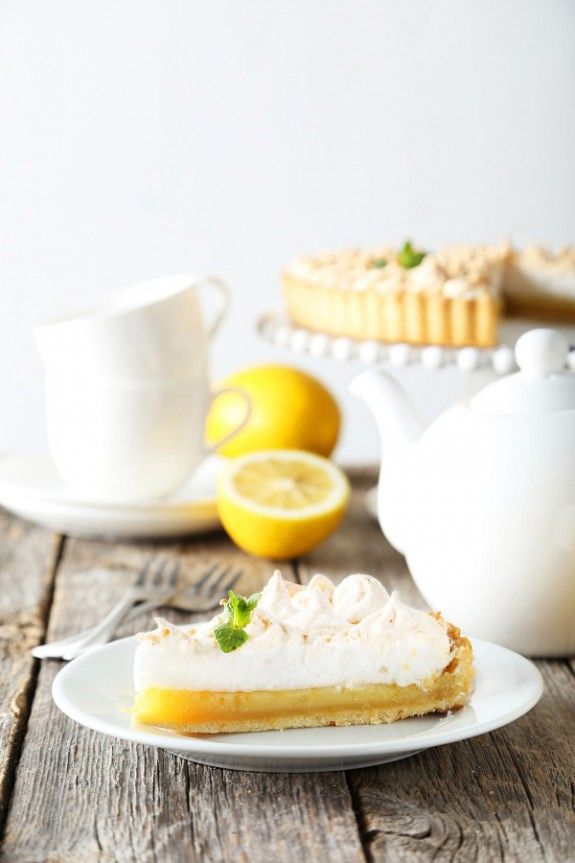 42070483 – lemon meringue pie on plate on grey wooden background
