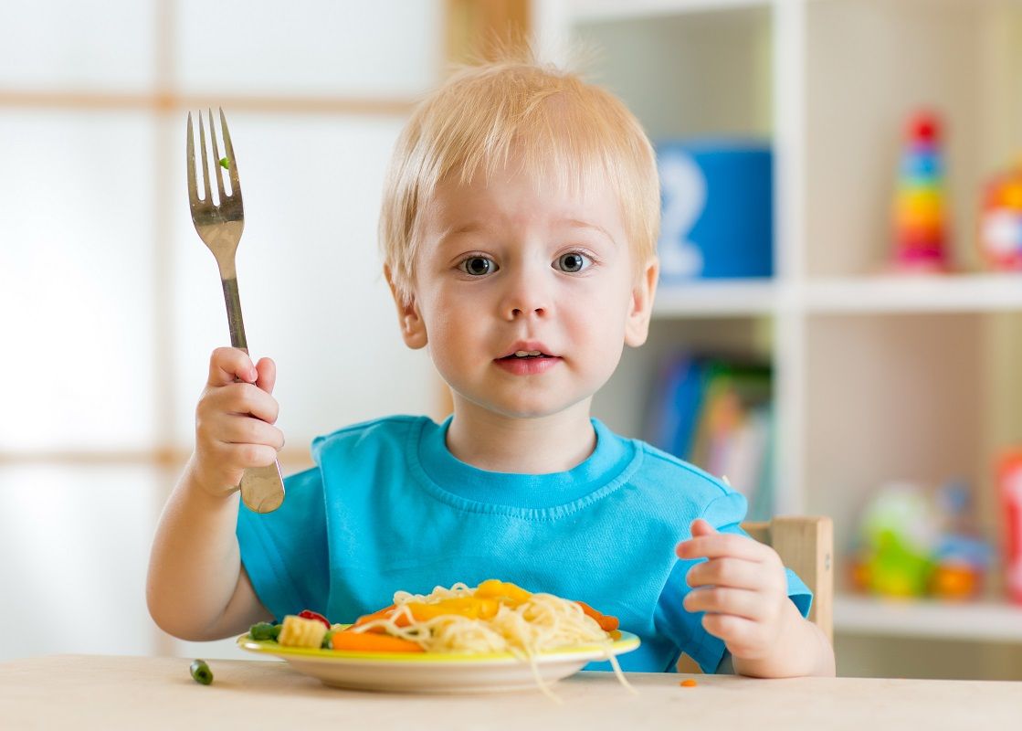 kid eating healthy food at home