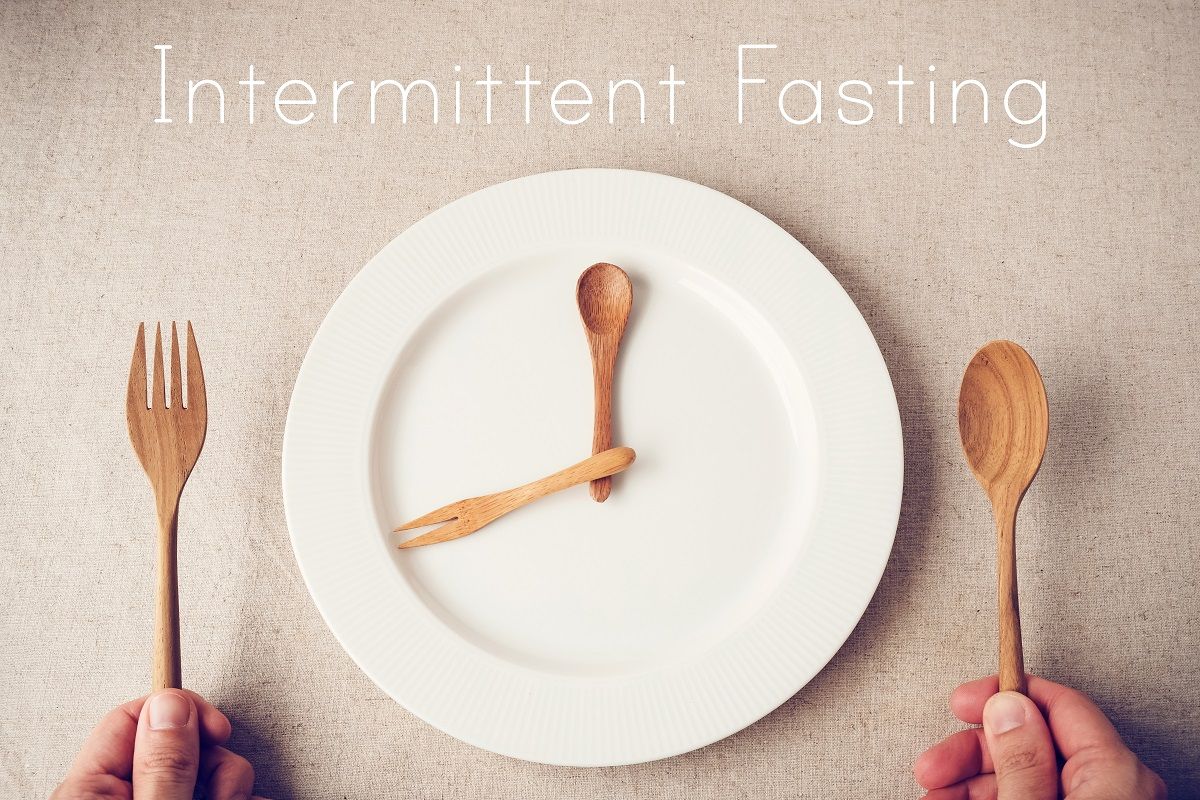 white plate with spoon and fork, Intermittent fasting concept, k