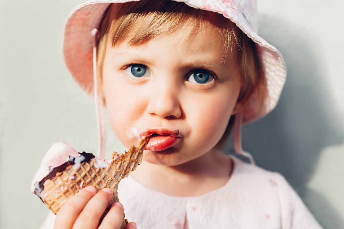 Little girl eating ice cream