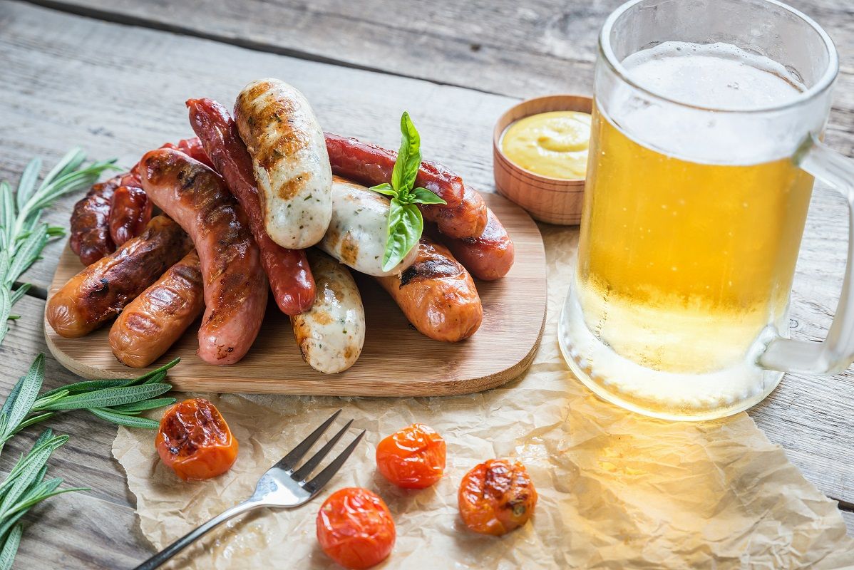 Grilled sausages with glass of beer