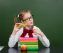 Young girl drink milk in classroom