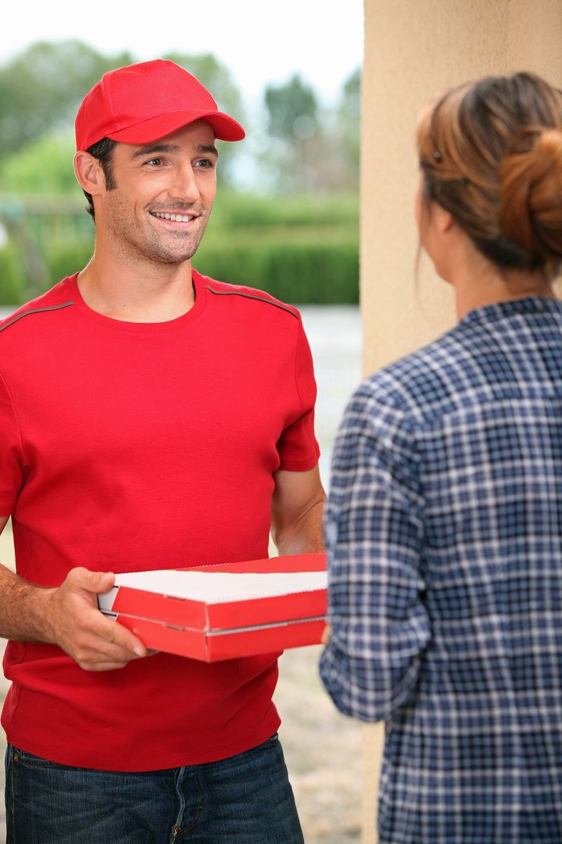 13839959 – man delivering pizza