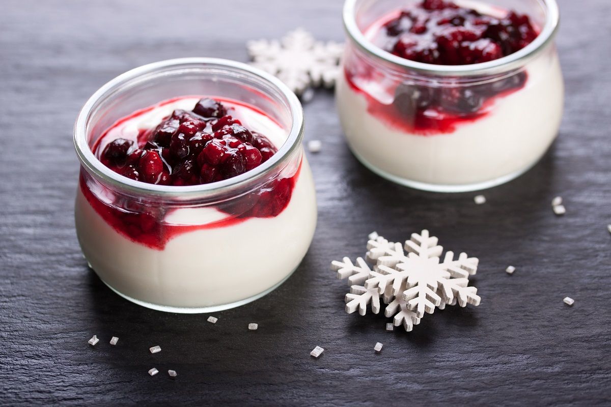 Jelly with berries in glass jar for christmas on dark background