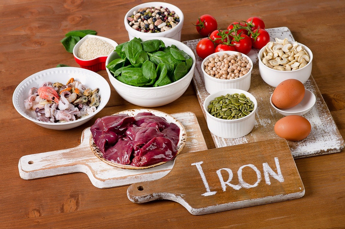 Foods high in Iron, including eggs, nuts, spinach, beans, seafoo