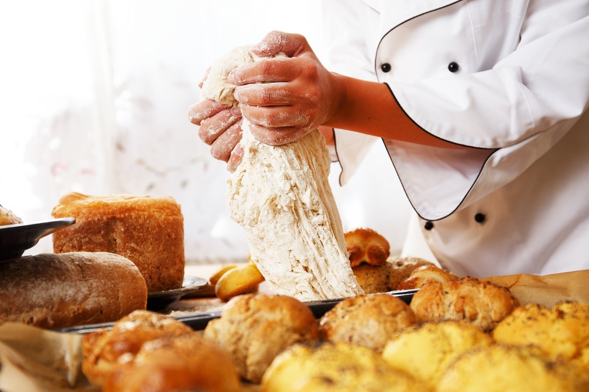 Cook hands preparing dough for homemade pastry