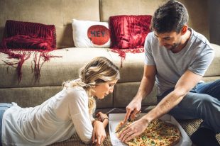 Couple enjoying ordered pizza