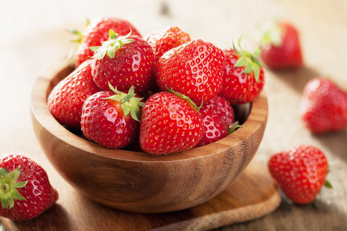 fresh strawberry in wooden bowl