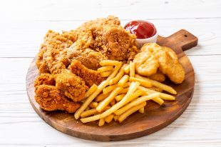 fried chicken with french fries and nuggets meal