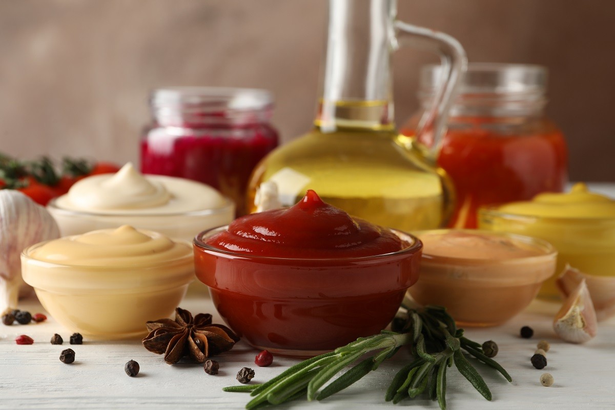 Set of different delicious sauces, olive oil, garlic, tomato che