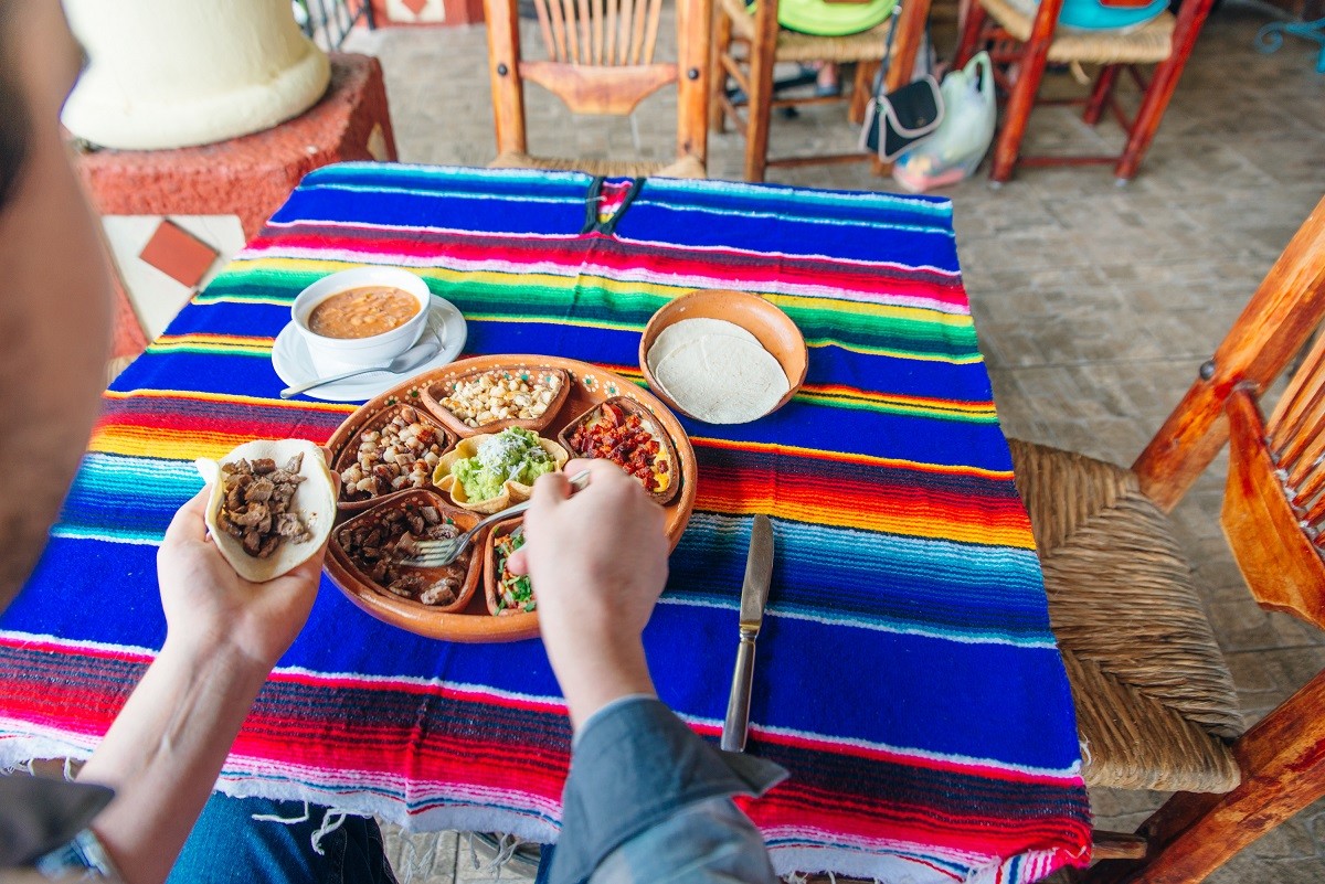 mexican plate with different meat and guacamole.