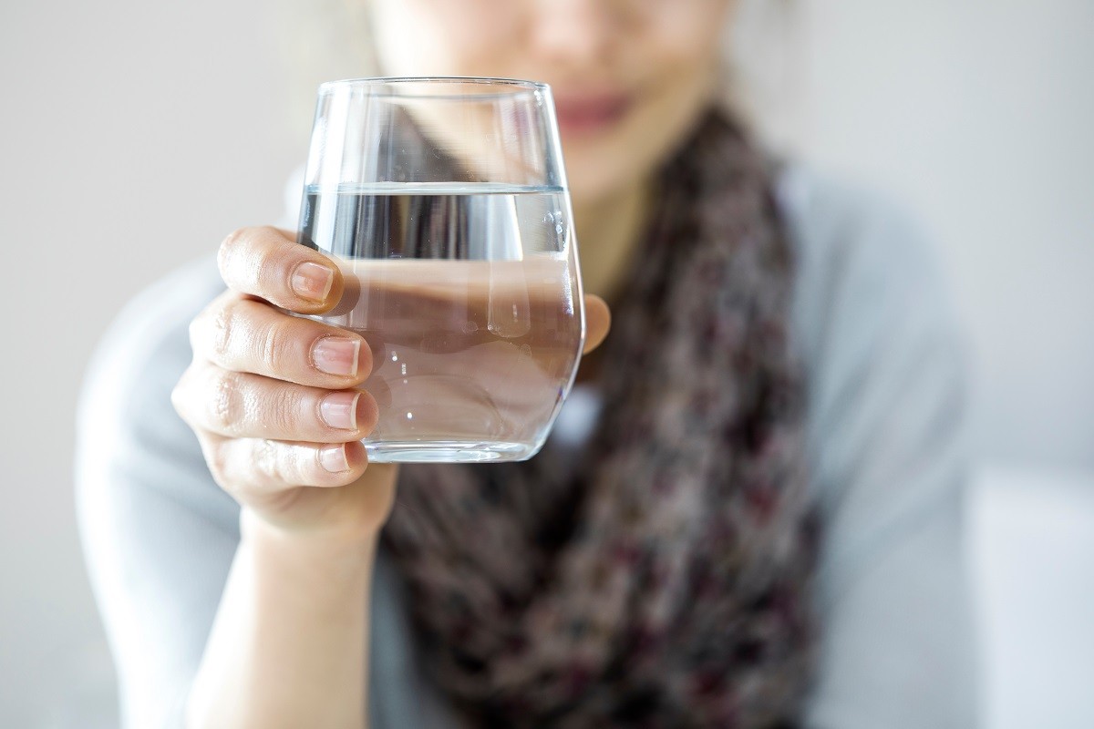 Young woman drinking water