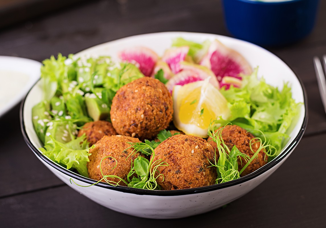 Falafel and fresh vegetables. Buddha bowl. Middle eastern or ara