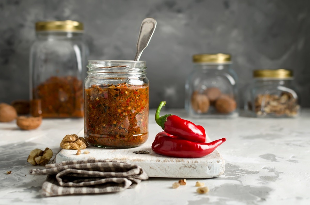 Homemade sauce adjika with vegetables and walnuts