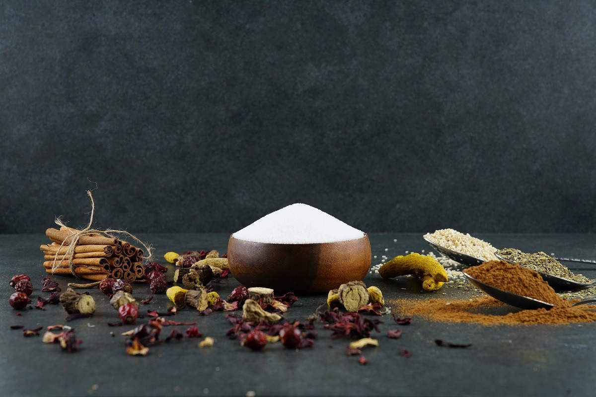 Salt and herbs on wooden background stock photo