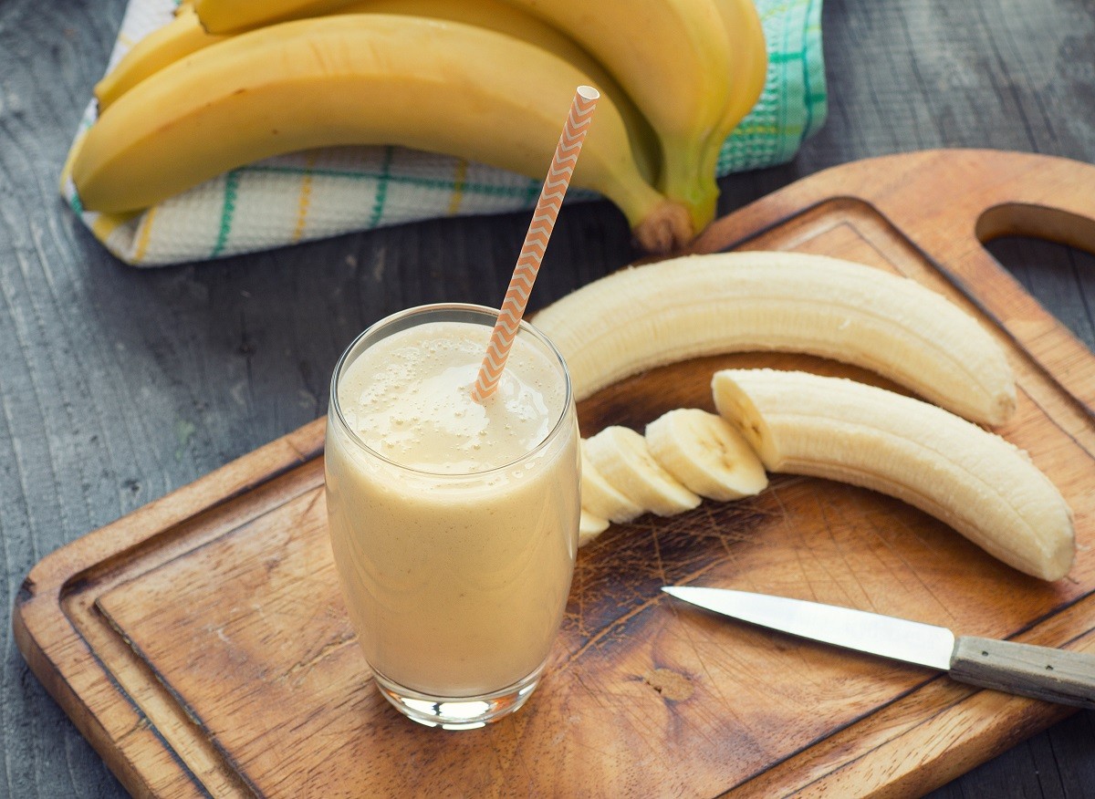 Fresh made Banana smoothie on wooden background