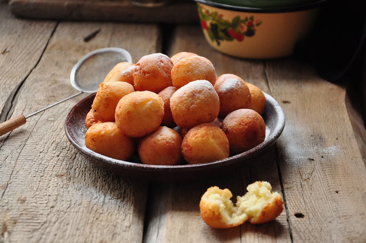 Small balls of freshly baked homemade cottage cheese doughnuts i