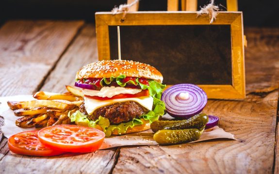 Juicy and fragrant hamburger with fries homemade copy space for