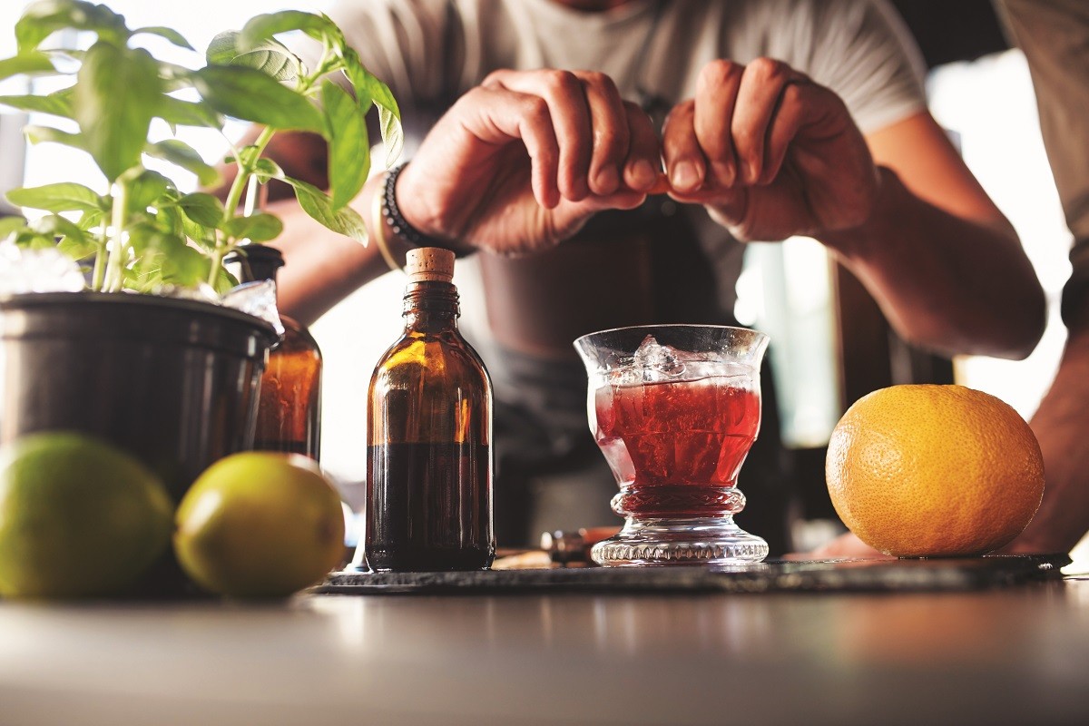 Bartender preparing negroni cocktail