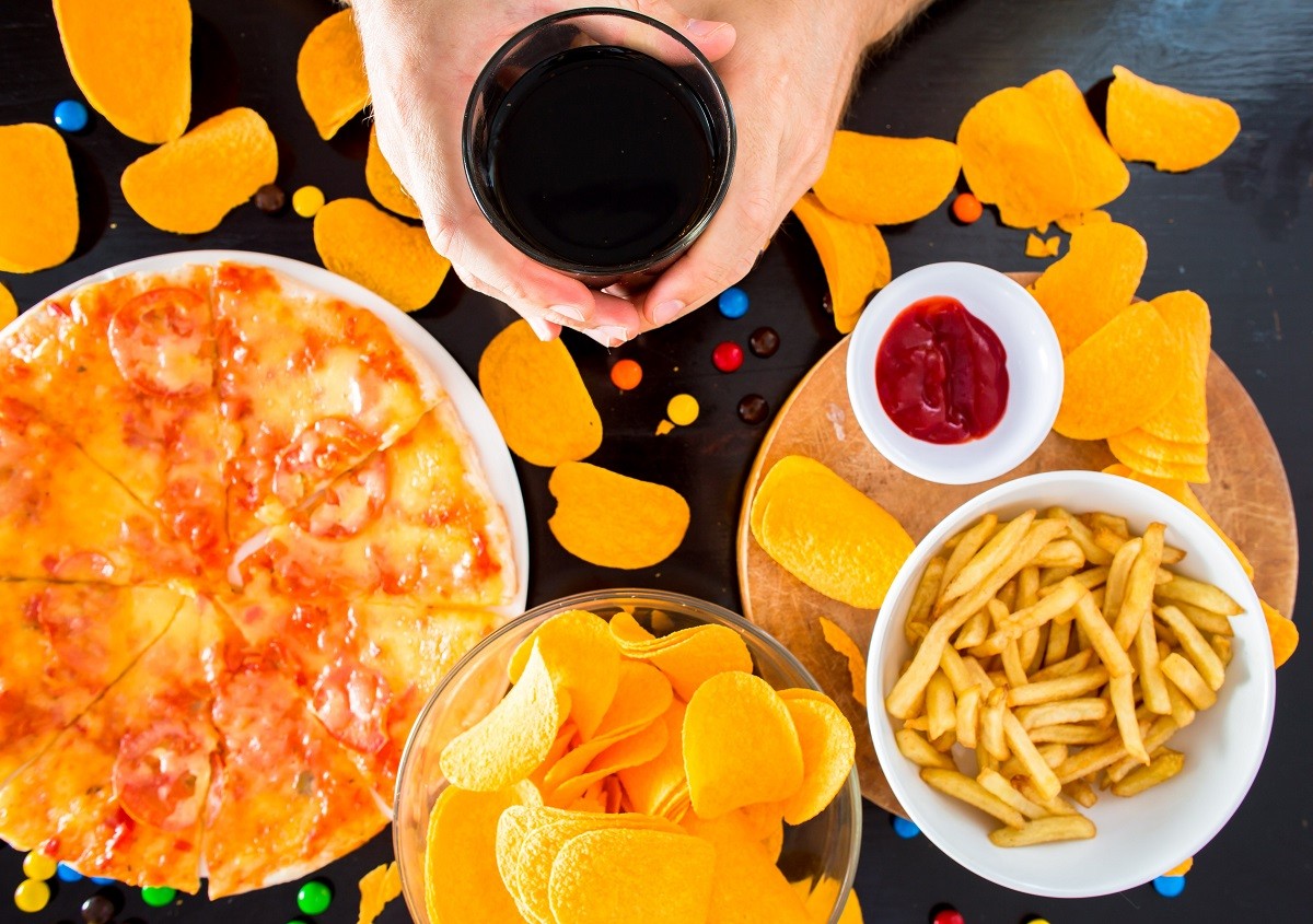 Fast food and unhealthy eating concept – close up of pizza,, fre