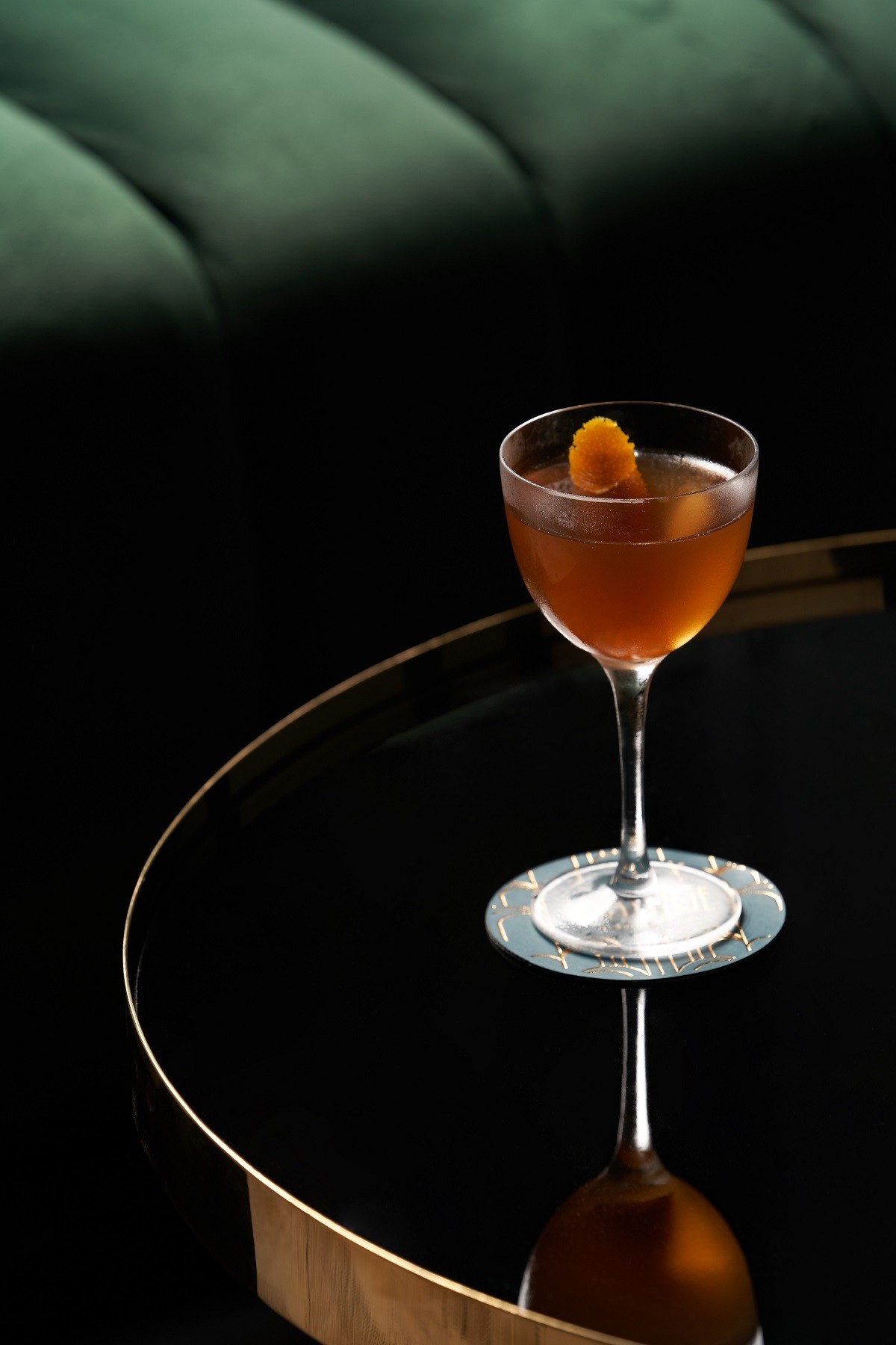 Fresh cocktail glass on glass table in night club restaurant