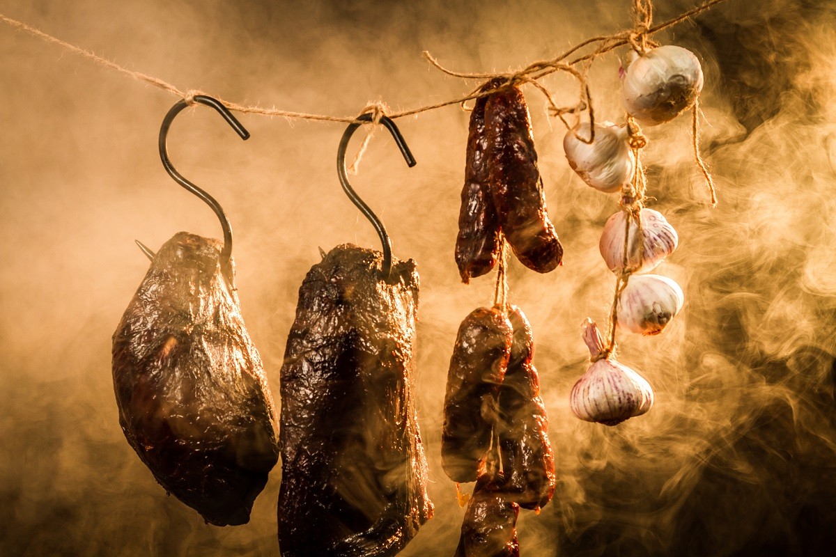 Ham, sausage and garlic in a smokehouse