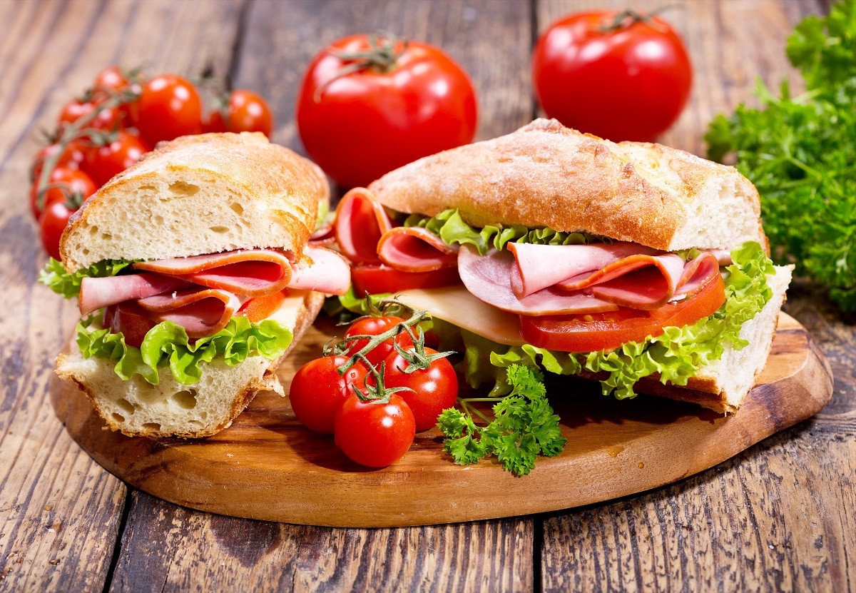 two sandwiches with ham and vegetables