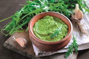 Arugila pesto in a rustc bowl
