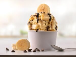 Banana ice cream cup on white table homemade in kitchen