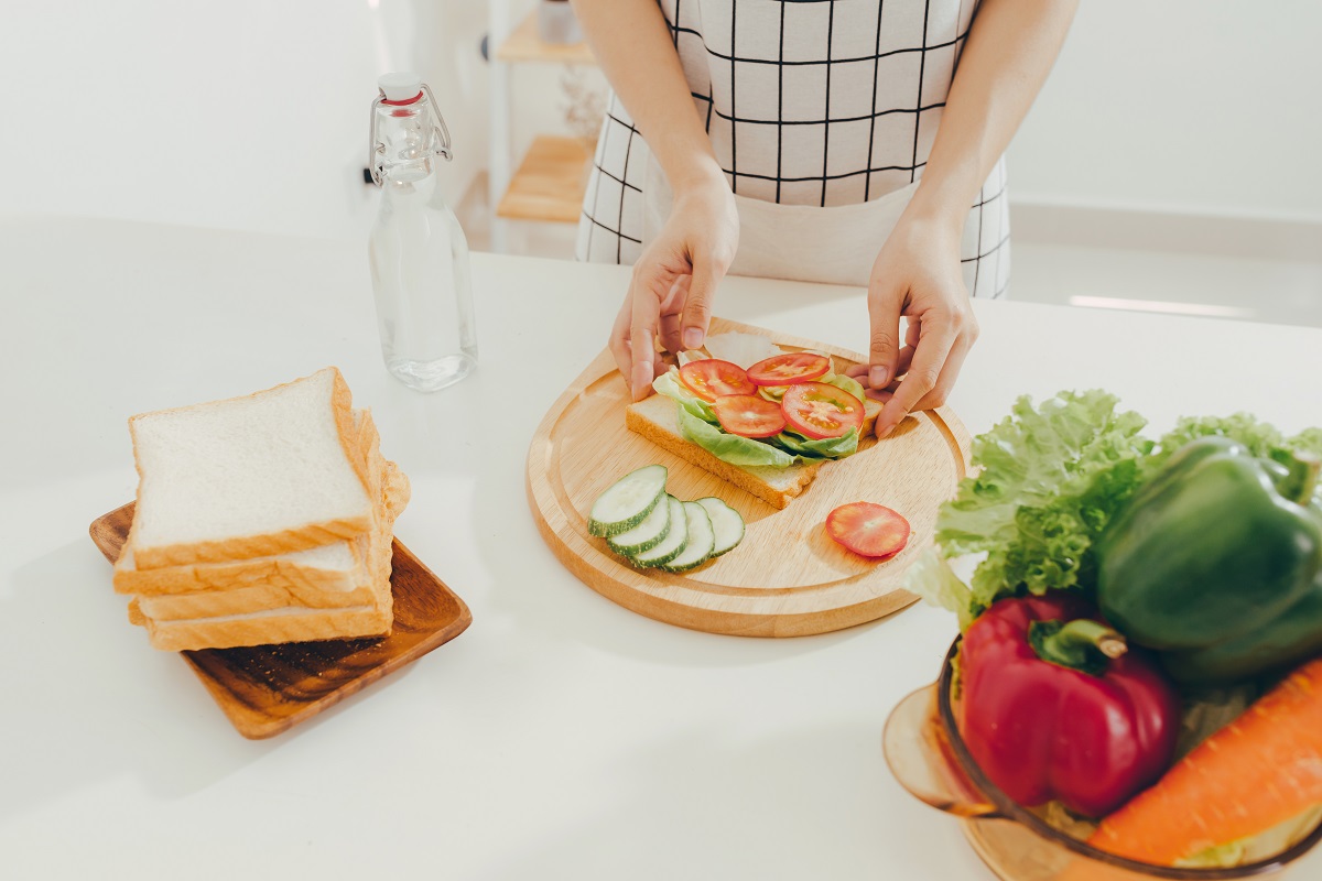 Woman apron preparing a breakfast in the kitchen