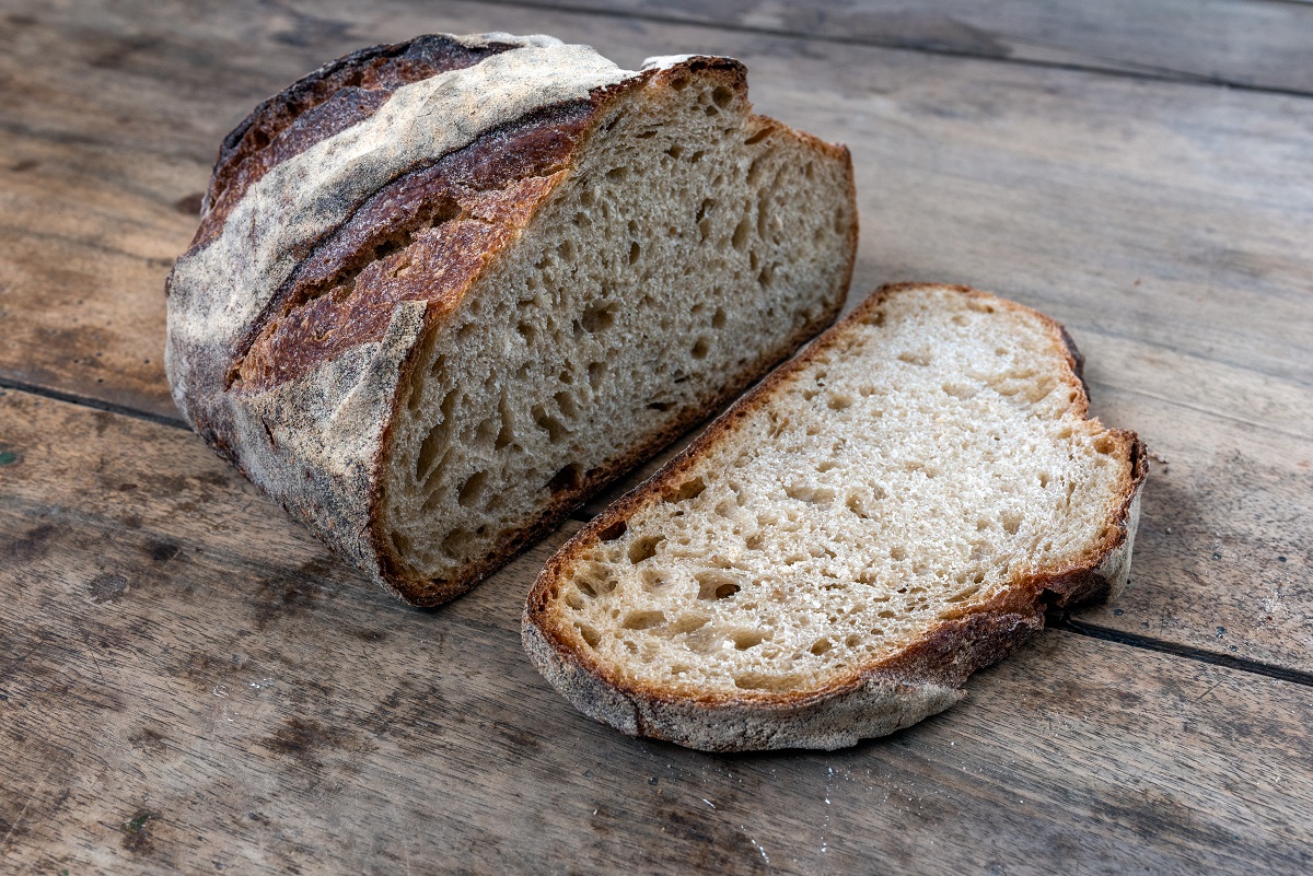 Sliced bread on a wooden table.