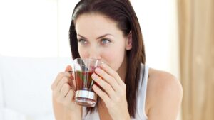 Pretty woman drink a tea