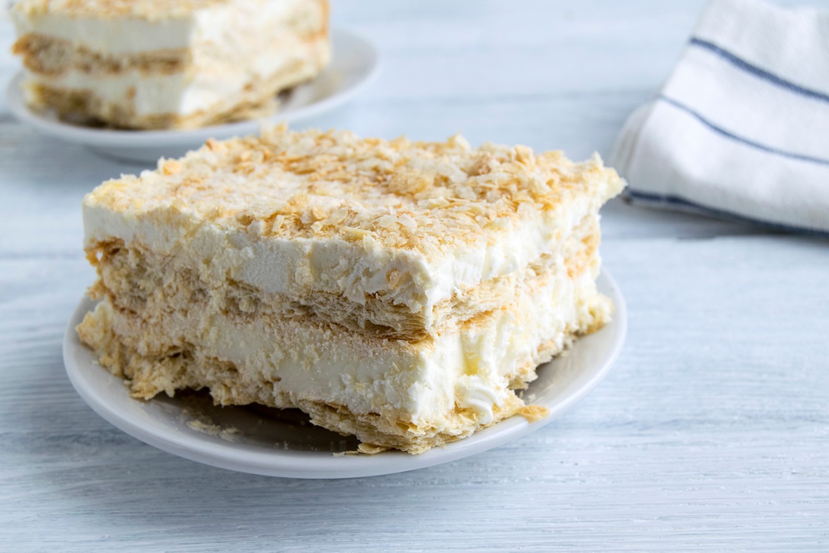 A,Piece,Of,Cake,Is,On,A,White,Plate.,Napoleon