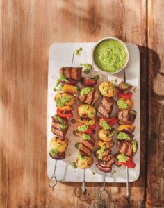 Smoky steak and potato skewerswith chimichurri sauce