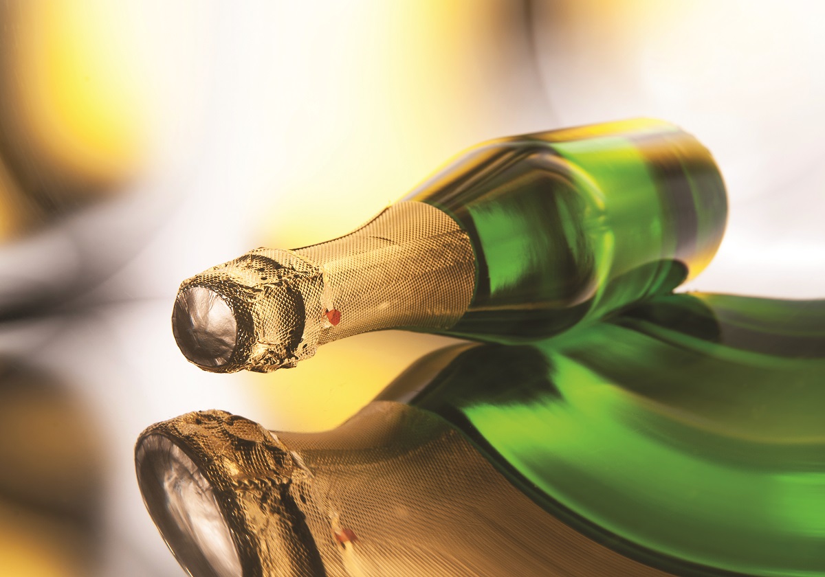 Bottle of champagne with reflection, horizontal