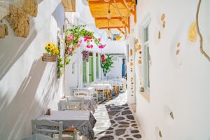 Old Market Town lane lined with table and chairs.