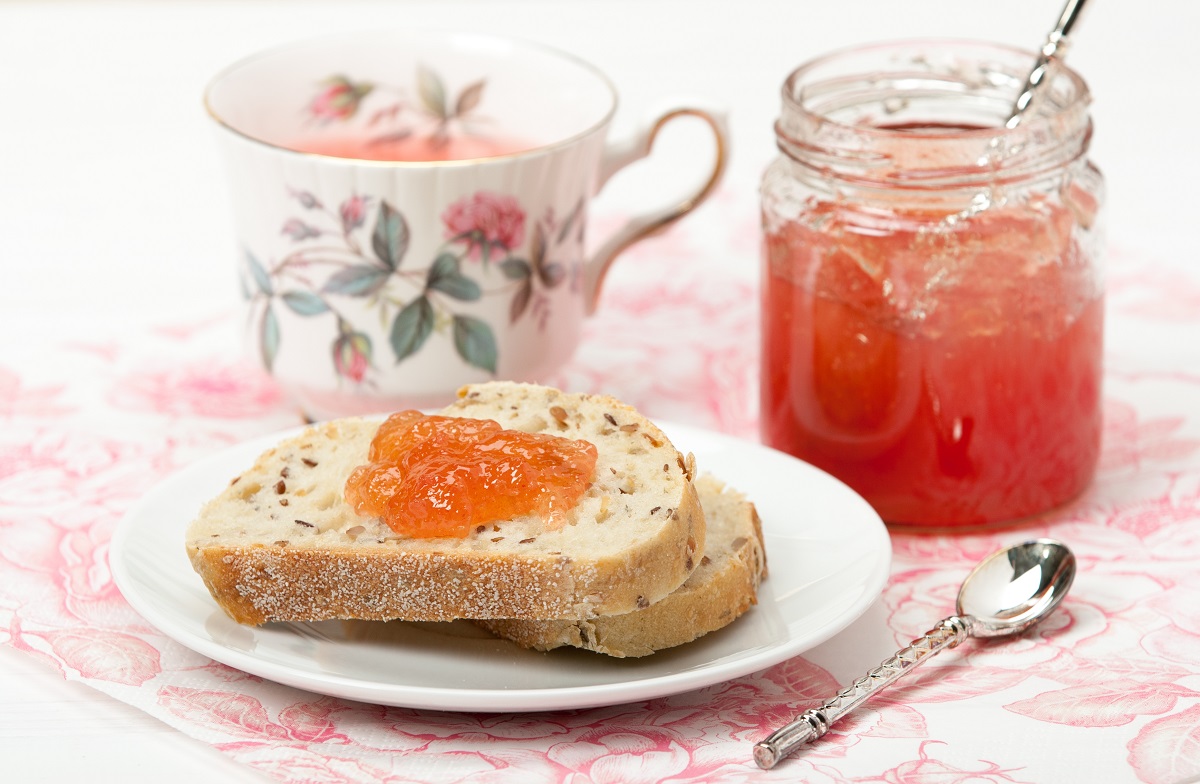 Watermelon Jam, Herbal Tea, Marshmallows. White Wooden Table.