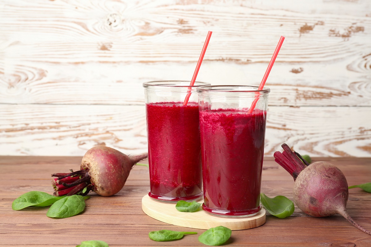 Glasses of fresh beet smoothie on table