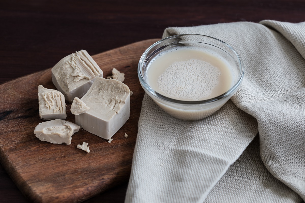 Live,Yeast,On,A,Wooden,Board,And,A,Cup,With