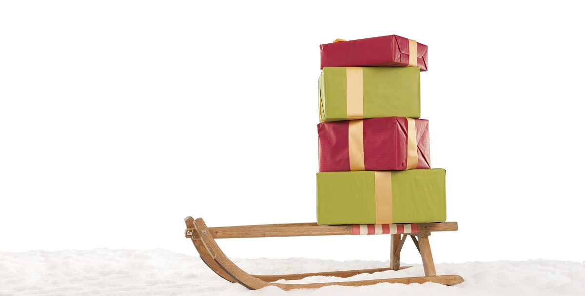 Sledge,With,Stack,Of,Chrismas,Presents,In,The,Snow