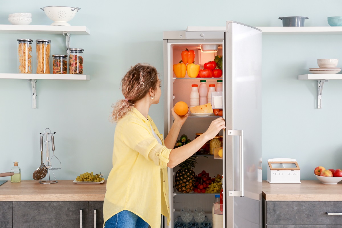 Woman,Choosing,Food,In,Modern,Fridge,At,Home