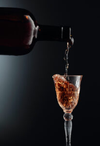 Aged,Golden,Fortified,Wine,From,The,Vintage,Bottle,Being,Poured