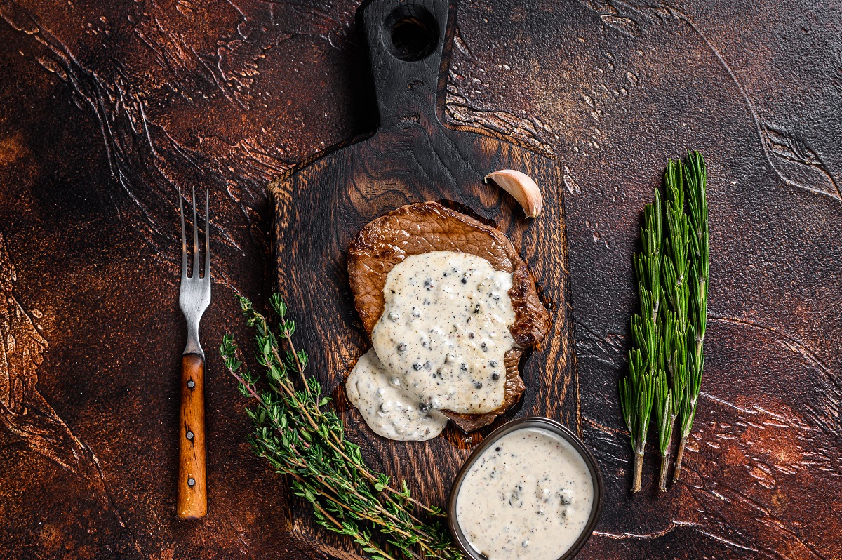 Grilled,Sirloin,Beef,Meat,Steak,With,Peppercorn,Sauce.,Dark,Background.