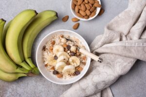 Top,View,Of,Oatmeal,With,Fresh,Banana,Slices,,Almond,,Hazelnut