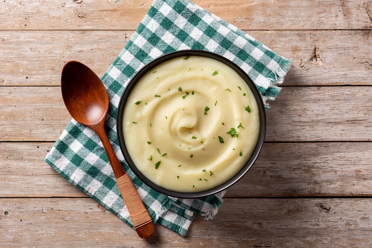 Mashed,Potatoes,In,A,Bowl,On,Wooden,Table.,Top,View