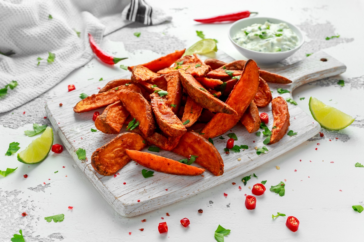 Healthy,Homemade,Baked,Orange,Sweet,Potato,Wedges,With,Fresh,Cream