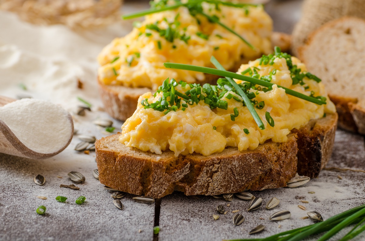 Scrambled,Eggs,With,Herbs,On,Wheat-rye,Crispy,Bread,,Homemade