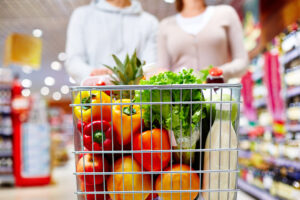 Image,Of,Cart,Full,Of,Products,In,Supermarket,Being,Pushed