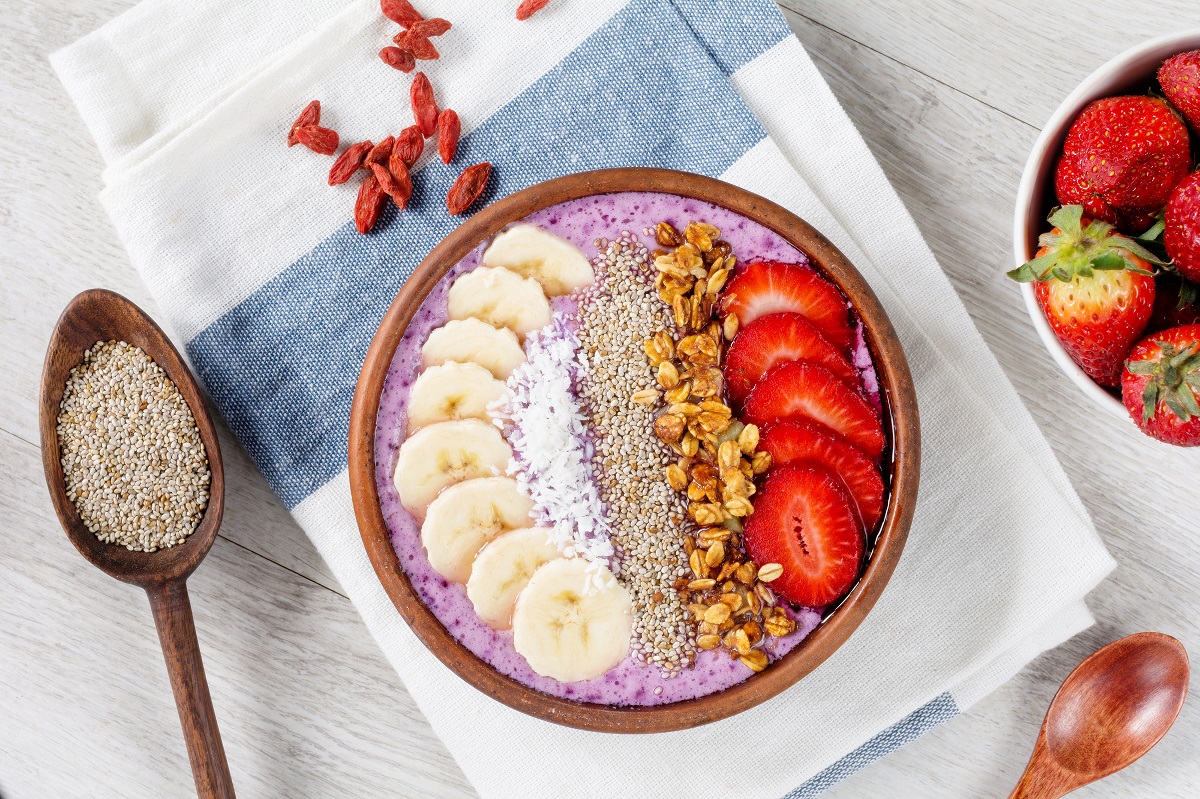 Smoothie,Bowl,With,Chia,Seeds,,Muesli,,Strawberries,,Banana,Slices,And