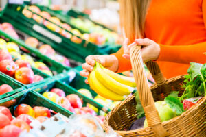 Woman,In,Supermarket,At,The,Fruit,Shelf,Shopping,For,Groceries,